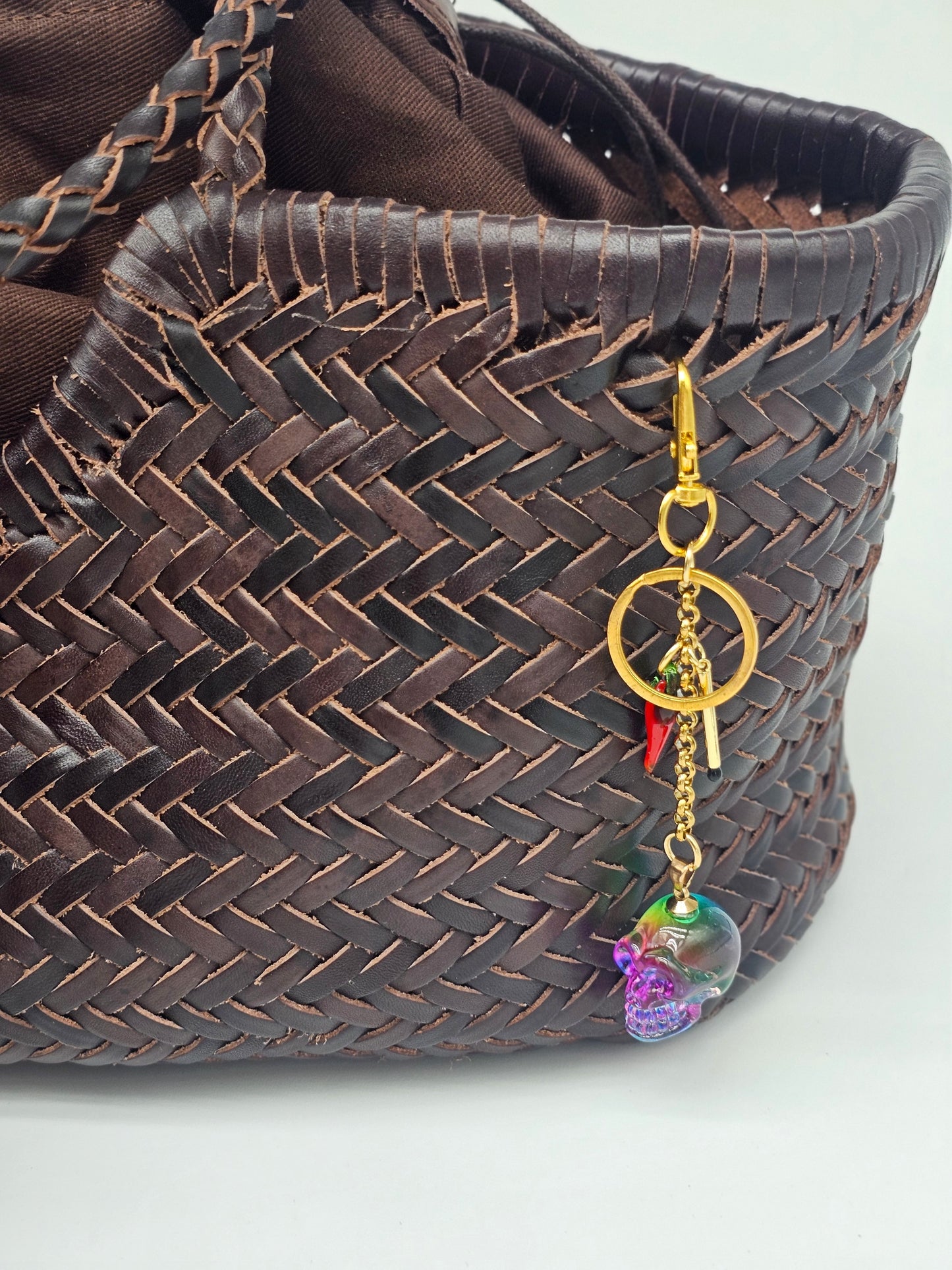 Handmade rainbow glass skull bag charm with gold-plated stainless steel chain