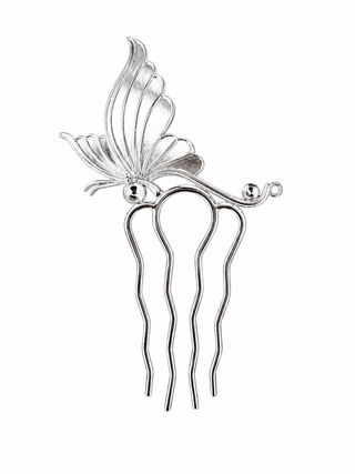 Silver hair comb with butterfly design on a white background