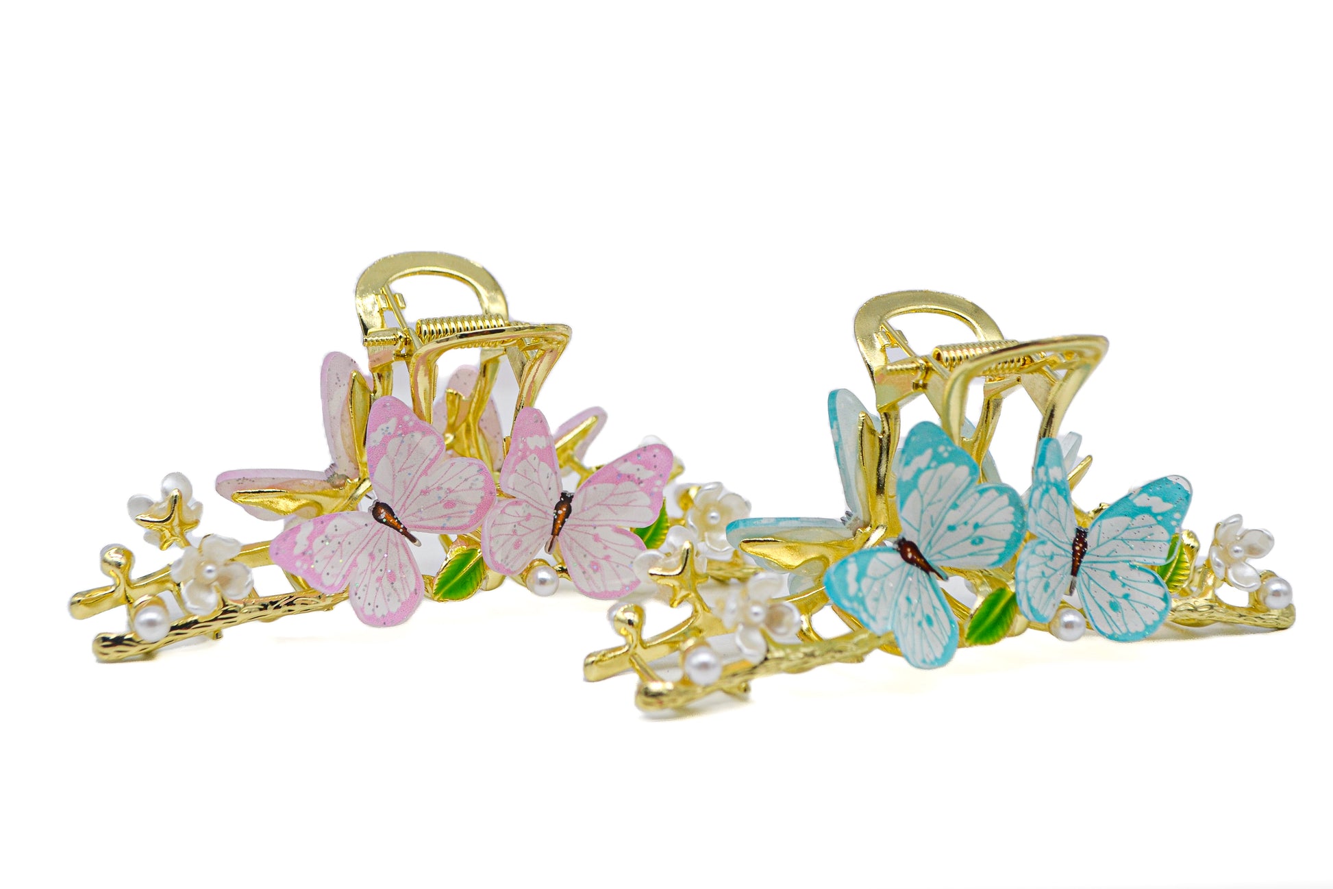 Gold metal claw hair clip with butterfly accents, elegant and delicate accessory for styling hair.