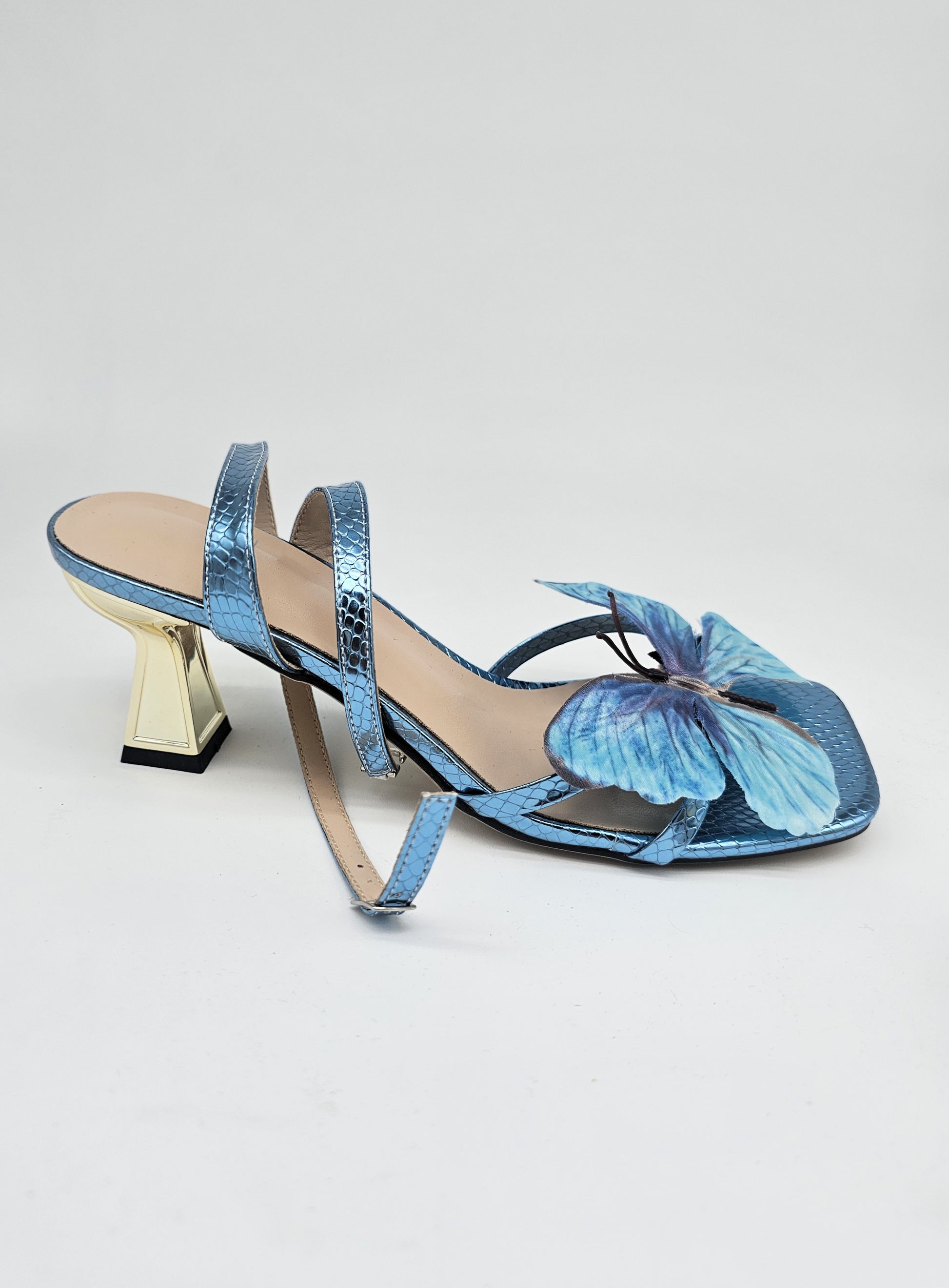 Elegant blue sandals with lifelike butterfly accent and square toe, comfortable heels for casual and formal wear.