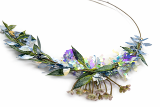Floral wreath with green leaves and colorful flowers on a white background
