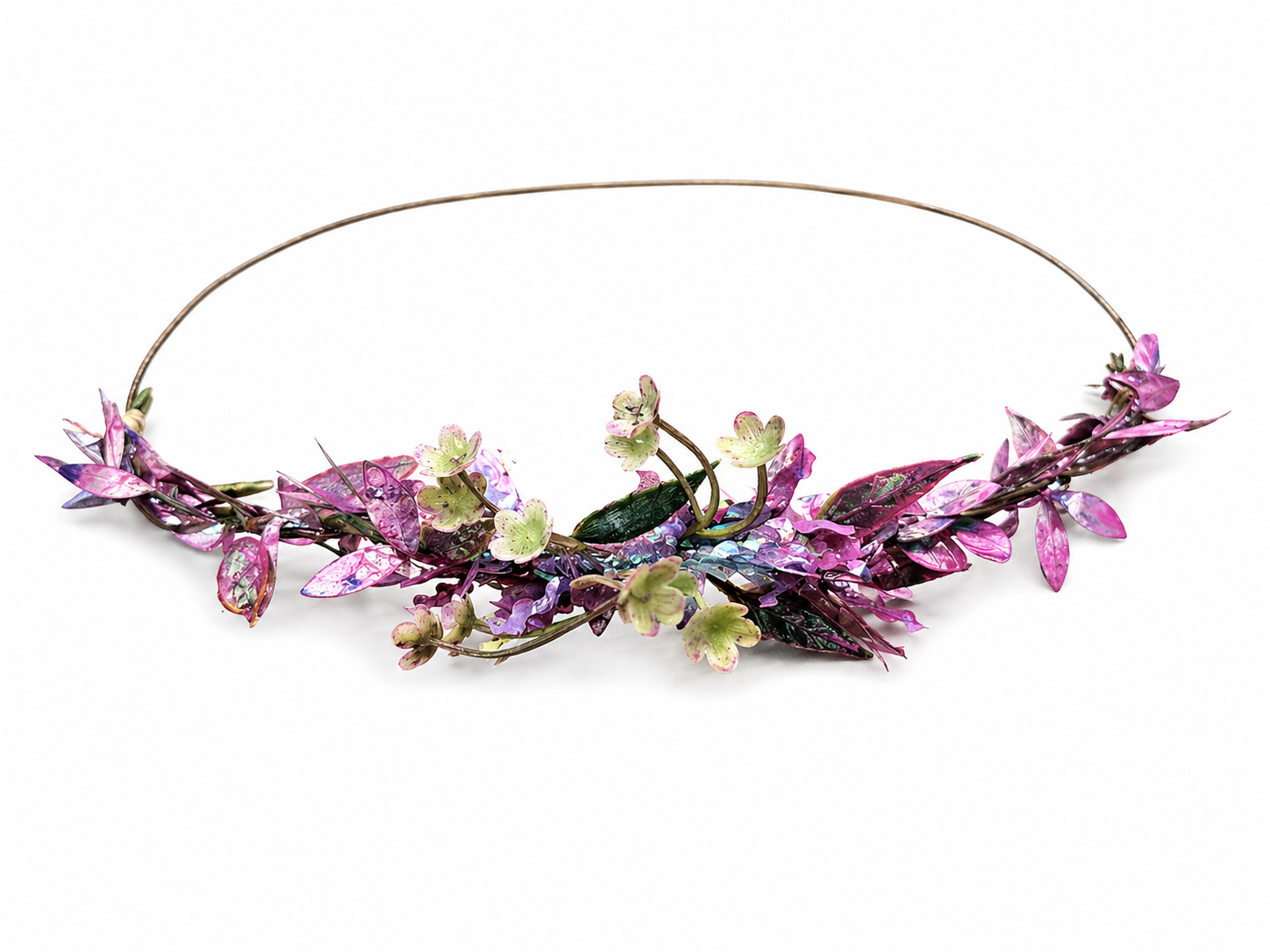 Floral headpiece with pink and green flowers on a white background